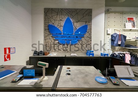 SAINT PETERSBURG, RUSSIA - CIRCA AUGUST, 2017: inside Adidas store. Adidas AG is a German multinational corporation, that designs and manufactures shoes, clothing and accessories.