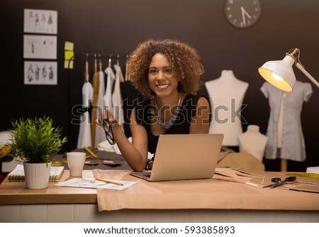 Two young entrepreneur women, and fashion designer working on her atelier