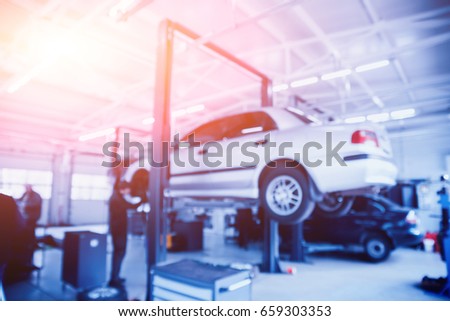 Auto repair service. Blurred background.