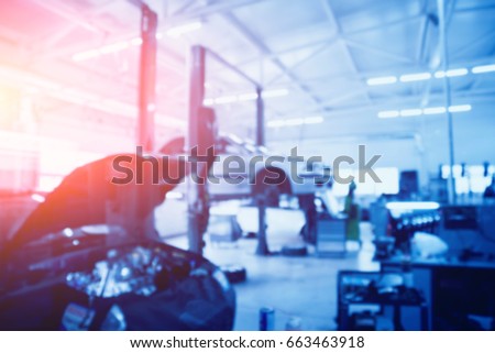 Auto repair service. Blurred background.
