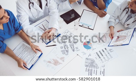 Cropped image of successful medical doctors discussing diagnosis during the conference