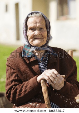 https://thumb1.shutterstock.com/display_pic_with_logo/559519/186882617/stock-photo-very-old-woman-with-head-scarf-sitting-and-relaxing-in-the-garden-186882617.jpg