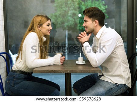https://thumb1.shutterstock.com/display_pic_with_logo/559861/559578628/stock-photo-portrait-of-beautiful-young-couple-in-love-at-a-coffee-shop-559578628.jpg