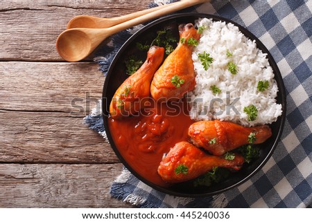 https://thumb1.shutterstock.com/display_pic_with_logo/564163/445240036/stock-photo-chicken-drumstick-with-sriracha-chilli-sauce-and-rice-garnish-on-a-plate-close-up-horizontal-view-445240036.jpg