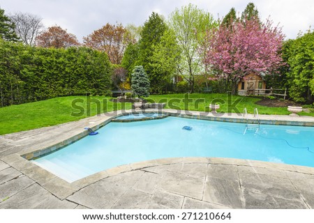 backyard with outdoor inground residential private swimming pool and stone patio - Outdoor Backyard Pools backyard with outdoor inground residential private swimming pool and stone patio - Outdoor Backyard Pools