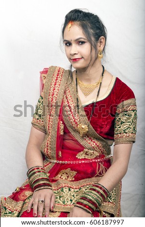 https://thumb1.shutterstock.com/display_pic_with_logo/569320/606187997/stock-photo-indian-beautiful-bride-wearing-red-lehenga-sitting-pose-606187997.jpg