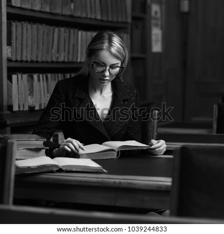 https://thumb1.shutterstock.com/display_pic_with_logo/571009/1039244833/stock-photo-beautiful-blonde-woman-wearing-elegant-black-tweed-jacket-and-glasses-sitting-at-desk-beside-1039244833.jpg