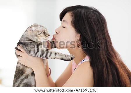 https://thumb1.shutterstock.com/display_pic_with_logo/572953/471593138/stock-photo-young-woman-holding-and-kissing-her-lovely-cat-471593138.jpg