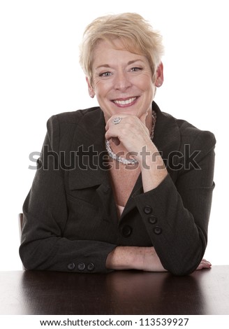 https://thumb1.shutterstock.com/display_pic_with_logo/57581/113539927/stock-photo-mature-woman-sitting-behind-desk-on-white-background-113539927.jpg