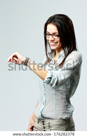 Sud BiH oslobodio Nasera Orića za optužbe o ubijanju srpskih civila - Page 8 Stock-photo-young-happy-businesswoman-looking-at-her-watch-on-wrist-on-gray-background-176282378