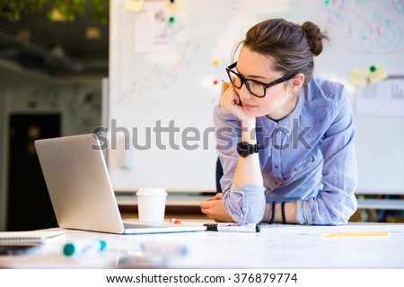 Young female businesswoman in the office