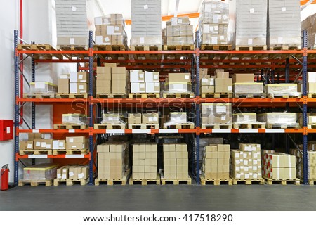 Crates And Boxes At Shelving System In Warehouse Crates And Boxes At Shelving System In Warehouse