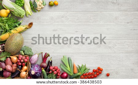 Organic food background. Studio photo of different fruits and vegetables on white wooden table. High resolution product.