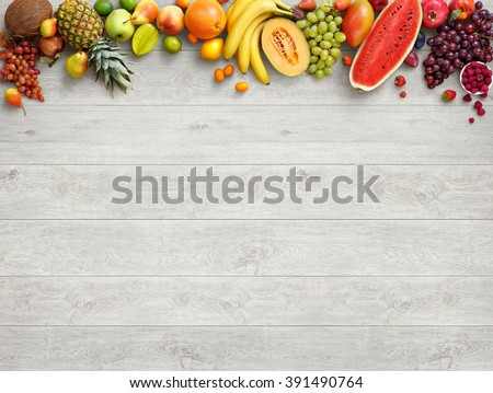 Healthy food background. Studio photo of different fruits on white wooden table. High resolution product.
