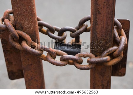 stock-photo-closeup-shot-of-a-big-metallic-chains-with-big-lock-that-locks-gates-495632563.jpg