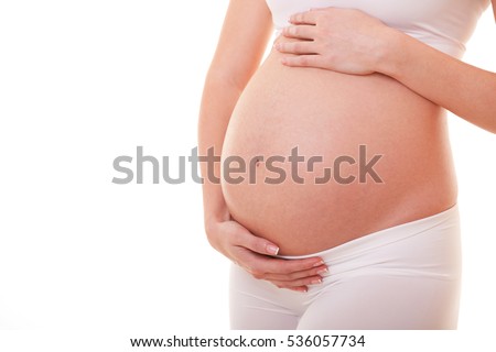 Image of pregnant woman touching her big belly. Close up. Motherhood, pregnancy, people and expectation concept. Pregnant woman expecting baby