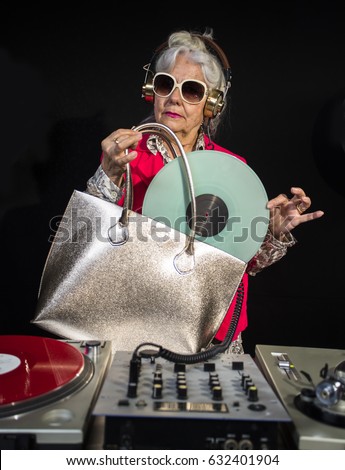 https://thumb1.shutterstock.com/display_pic_with_logo/59071/632401904/stock-photo-an-amazing-grandma-dj-older-lady-djing-and-partying-in-a-disco-setting-632401904.jpg
