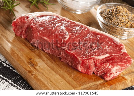 Organic Red Raw Steak Sirloin against a background