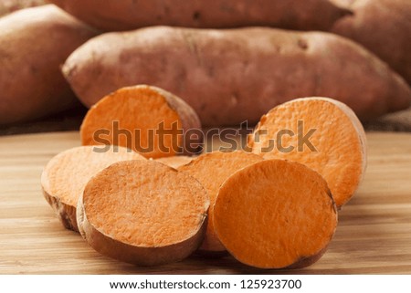 Fresh Organic Orange Sweet Potato against a background