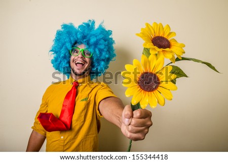 http://thumb1.shutterstock.com/display_pic_with_logo/598642/155344418/stock-photo-crazy-funny-young-man-with-blue-wig-on-white-background-155344418.jpg