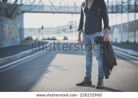 young handsome attractive bearded model man in urban context