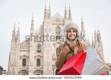 https://thumb1.shutterstock.com/display_pic_with_logo/603946/401023984/stock-photo-discovering-italian-treasures-hidden-in-milan-happy-woman-with-shopping-bags-in-the-front-of-duomo-401023984.jpg