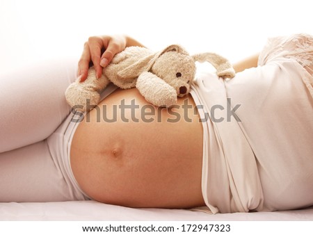 a pregnant woman on a white background