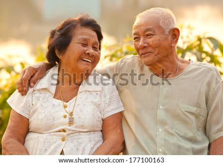 https://thumb1.shutterstock.com/display_pic_with_logo/607978/177100163/stock-photo-happy-asian-senior-couple-sitting-outdoors-on-sunset-177100163.jpg
