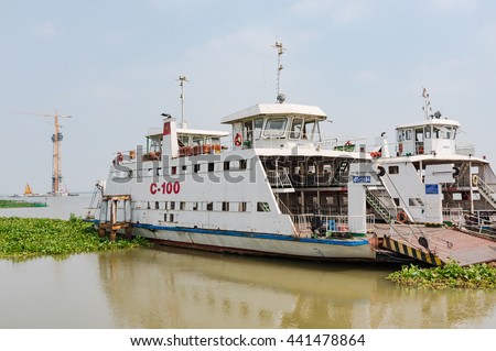 Cao Lanh, Vietnam - March 17, 2016: Car ferries in the Mekong Delta of Vietnam are rapidly being replaced by motorway bridges, like here near Cao Lanh, the capital of Dong Thap Province.