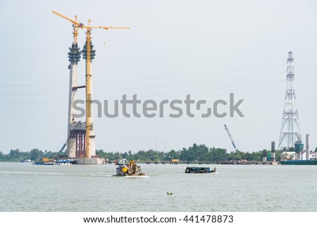Cao Lanh, Vietnam - March 17, 2016: Car ferries in the Mekong Delta of Vietnam are rapidly being replaced by motorway bridges, like here near Cao Lanh, the capital of Dong Thap Province.