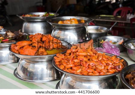 Local Vietnamese food at a market in Cao Lanh, the capital of Dong Thap Province in Vietnam. Shallow depth of field with the shrimps in the foreground in focus.