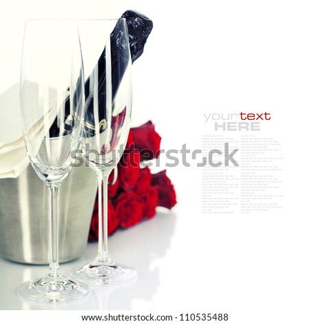 Romantic still life with champagne and beautiful red roses over white (with easy removable text)