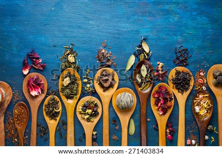 Dry tea with in wooden spoons. Top view