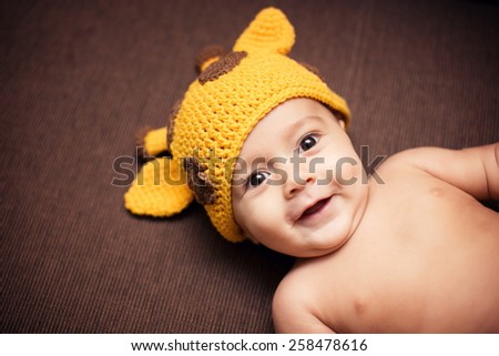 Baby Boy In A Funny Giraffe Hat Baby Boy In A Funny Giraffe Hat