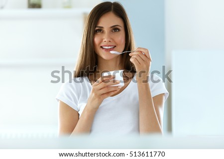 Healthy Lifestyle. Portrait Of Beautiful Sexy Smiling Woman Tasting Fresh Organic Yogurt. Charming Cheerful Girl On Diet Nutrition Eating Delicious Natural Yoghurt, Dairy Food. High Resolution