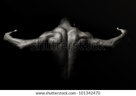 Beautiful and muscular black man's back in dark background by Luis ...