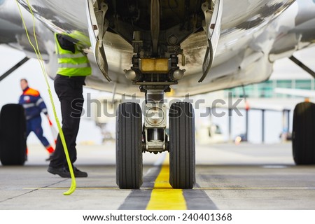 Airplane parked at the airport and preparation for next flight.