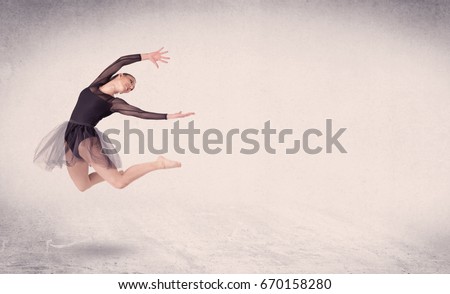 Modern ballet dancer performing art jump with empty copy space background