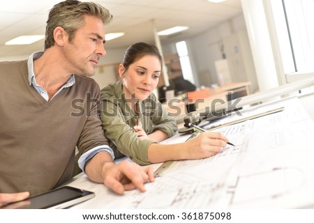 Architects working on project in office