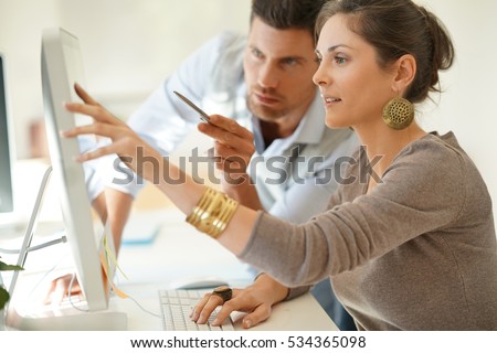 Startup business partners working together in desktop