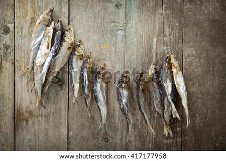Dried fish on old boards