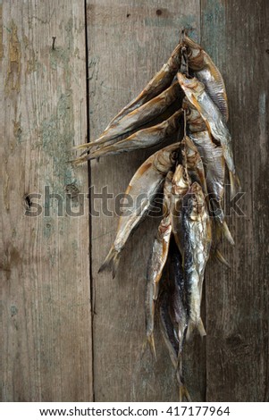Dried fish on old boards