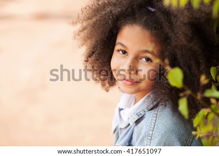 Outdoor portrait of a beautiful little girl