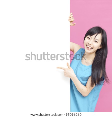 Cute woman pointing blank white board.
