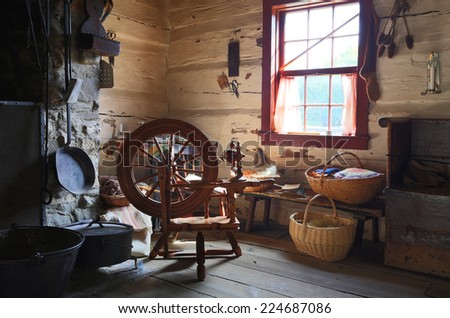 TORONTO OCTOBER 7 Interior Of An Old Country House With Antique Spinning Wheel In Black TORONTO OCTOBER 7 Interior Of An Old Country House With Antique Spinning Wheel In Black