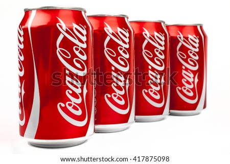 LONDON, UK - MAY 6TH 2016: Cans of Coca Cola drink isolated over a plain white background, on 6th May 2016. The drink is produced and manufactured by The Coca-Cola Company.