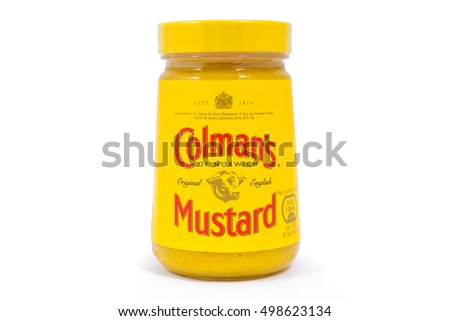 LONDON, UK - OCTOBER 13TH 2016: A shot of an unopened jar of Colmans Mustard over a plain white background, on 13th October 2016. The product is made by the Unilever company.