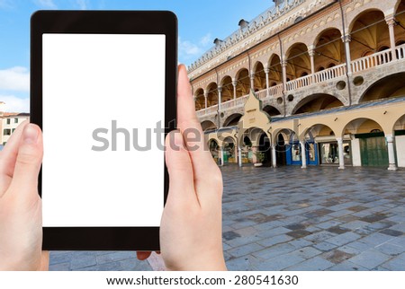 travel concept - tourist photograph Palazzo della Ragione on Piazza delle Erbe in Padua, Italy on tablet pc with cut out screen with blank place for advertising logo