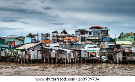 Riverside stilt houses in the Mekong Delta, south west of Can Tho, Vietnam