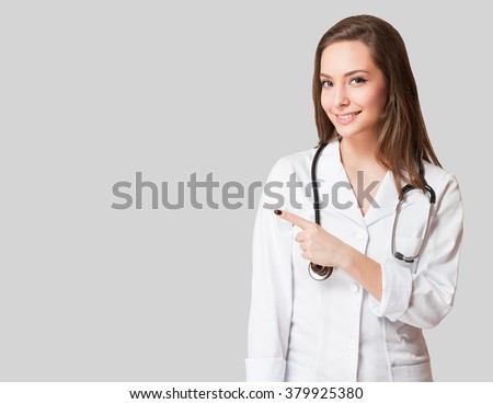 Portrait of an attractive young female doctor in white coat.
